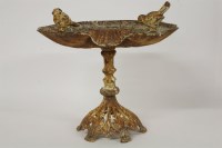 Lot 3162 - A cast iron and white painted bird bath 30cm tall