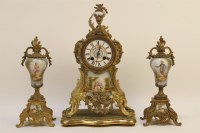 Lot 1537 - A 19th century French gilt bronze mantel clock with porcelain dial and panel