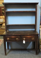 Lot 2228 - An 18th century oak dresser of small size with open shelves above two frieze drawers on square tapering supports