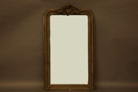 Lot 2151 - A gilt Gesso over mantle mirror with decorative relief work to the top