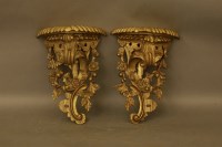 Lot 2024 - A pair of 20th century decorative gilt wood wall brackets