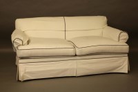 Lot 2045 - A contemporary cream upholstered two seater settee