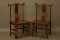 Lot 2085 - A pair of Chinese elm high back chairs