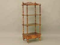 Lot 564 - A Victorian walnut four tier whatnot