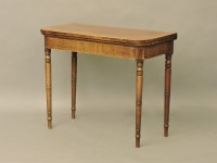 Lot 567 - A George III strung and crossbanded mahogany fold over card table