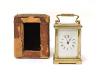 Lot 259 - A small brass carriage clock