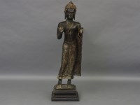 Lot 1543 - A standing bronze Buddha