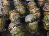 Lot 189 - A collection of eighteen Halcyon Days enamelled Easter eggs and stands
