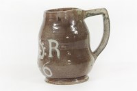 Lot 152 - A Castle Hedingham Bingham pottery Charles I style glazed mug