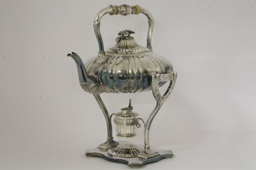 Lot 138 - A silver plated kettle on stand