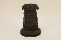 Lot 184 - A small turned and carved Irish bog oak spill and vase