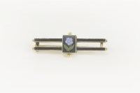 Lot 5 - A Victorian gold memorial black enamelled two row bar brooch
