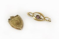 Lot 6 - A 9ct gold single stone garnet brooch