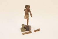 Lot 160 - An ancient Egyptian carved wooden votive figure of a dancer
