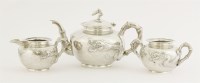 Lot 154 - A Chinese silver three-piece tea set