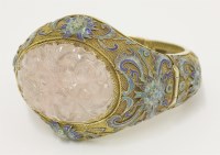 Lot 151 - A Chinese gold and enamel hinged bangle