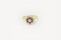 Lot 10 - A gold diamond and ruby cluster ring