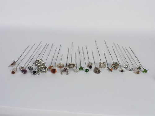 Lot 105 - A collection of silver and hatpins