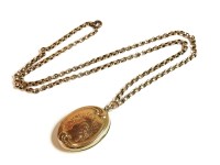 Lot 25 - A back and front oval locket on gold belcher chain
