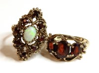 Lot 28 - A 9ct gold opal and garnet lozenge shaped cluster ring