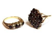 Lot 54 - A 9ct gold garnet and lozenge shaped cluster ring