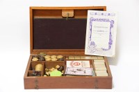 Lot 142 - A cased mahogany games box