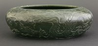 Lot 110 - A spinach-green jade Alms Bowl