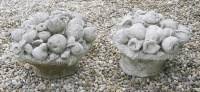 Lot 609 - A  near pair of carved stone finials