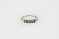 Lot 45 - A 9ct gold emerald and diamond half hoop eternity ring