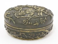 Lot 130 - A parcel-gilt bronze box and cover