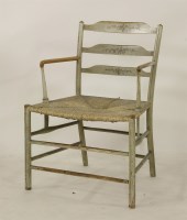 Lot 2227 - A 19th century painted ash ladderback elbow chair