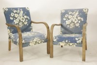 Lot 2148 - A pair of early 20th century limed oak open armchairs