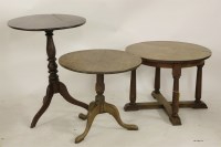 Lot 2076 - A 19th century oak low tripod table