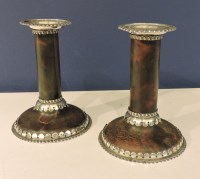 Lot 1091 - A pair of tortoiseshell and silver dwarf candlesticks