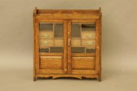 Lot 434 - A late Victorian large oak smokers cabinet