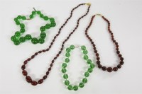 Lot 64 - Two single row graduated cherry coloured Bakelite bead necklaces