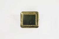 Lot 7 - A gold rectangular nephrite plaque brooch