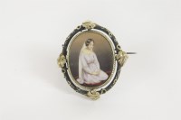 Lot 14 - A Victorian silver and gold enamel brooch