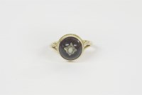 Lot 20 - A gold garnet cabochon stick pin converted to a ring