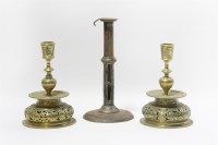 Lot 179 - A pair of 16th century style brass candlesticks