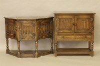 Lot 362 - An 18th century style oak credence cupboard with three carved panel doors