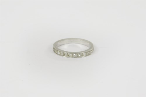 Lot 3 - A platinum diamond half eternity ring
