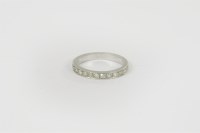 Lot 3 - A platinum diamond half eternity ring