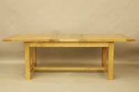 Lot 495 - An oak drawer leaf table