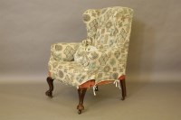 Lot 390 - A mahogany framed wing armchair