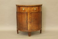 Lot 440 - A demi lune mahogany crossbanded tambour front cabinet