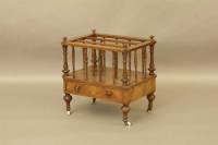 Lot 486 - A Victorian walnut canterbury