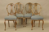 Lot 479 - Four beech wood single chairs with oval backs and scrolled front legs