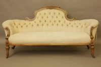 Lot 383 - A Victorian walnut and inlaid cream button upholstered settee