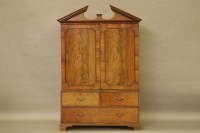 Lot 393 - A George III mahogany linen press
with four yew wood fronted slides